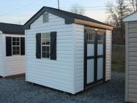 Pine Creek 8x8 HD Peak with White walls, Black trim and Black Z-Style shutters, and Charcoal shingles