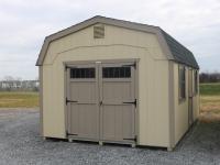 Pine Creek 12x20 New England Dutch Barn with Beige walls, PC Clay trim and PC Clay Z-Style shutters, and Barkwood shingles